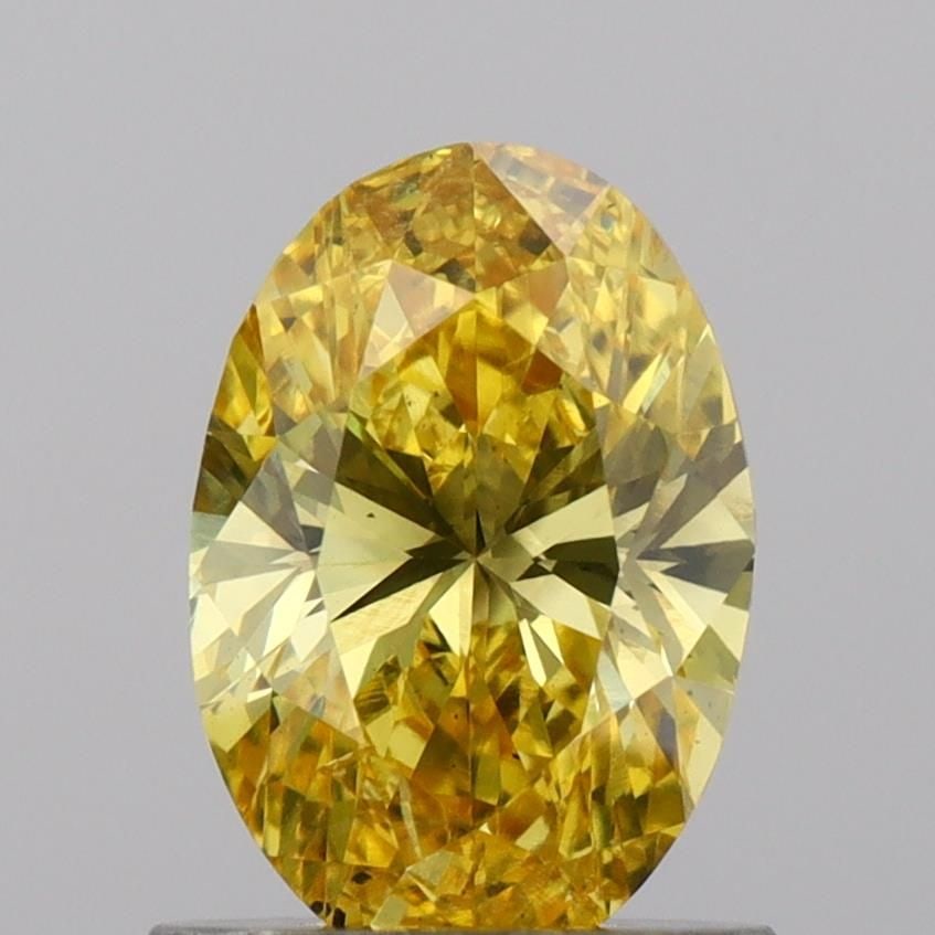 Loose Diamond - OVAL 0.97ct Fancy Vivid Yellow SI1: Loose Diamond - OVAL 0.97ct Fancy Vivid Yellow SI1 Source: This is a real non-mined Diamond that has been grown in a lab Shape: OVAL Carats: 0.97 Color: Fancy Vivid Yellow Certification: IGI Video: