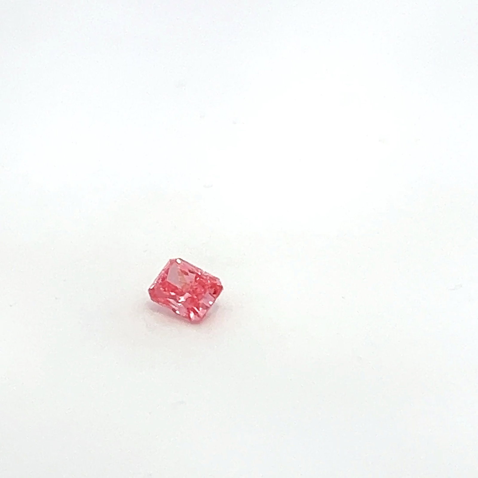 Loose Diamond - RADIANT 0.56ct Fancy Pink VVS2: Loose Diamond - RADIANT 0.56ct Fancy Pink VVS2 Source: This is a real non-mined Diamond that has been grown in a lab Shape: RADIANT Carats: 0.56 Color: Fancy Pink Certification: NONE The Diamond Depot