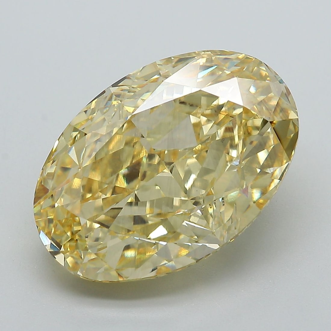 Loose Diamond - OVAL 10.25ct Fancy Vivid Yellow VS2: Loose Diamond - OVAL 10.25ct Fancy Vivid Yellow VS2 Source: This is a real non-mined Diamond that has been grown in a lab Shape: OVAL Carats: 10.25 Color: Fancy Vivid Yellow Certification: IGI Video: