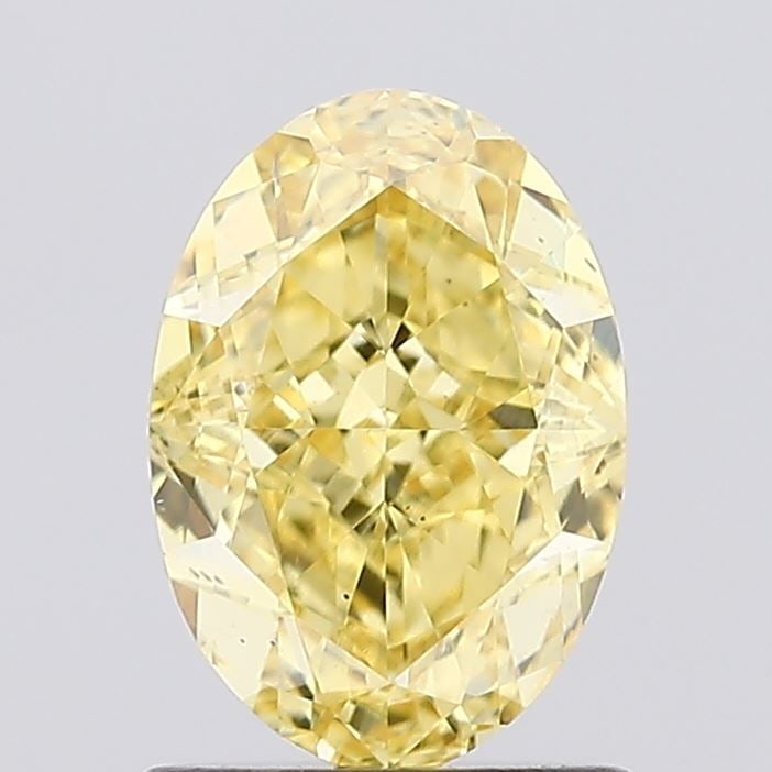 Loose Diamond - OVAL 1.29ct Fancy Vivid Yellow VS1: Loose Diamond - OVAL 1.29ct Fancy Vivid Yellow VS1 Source: This is a real non-mined Diamond that has been grown in a lab Shape: OVAL Carats: 1.29 Color: Fancy Vivid Yellow Certification: IGI Video: