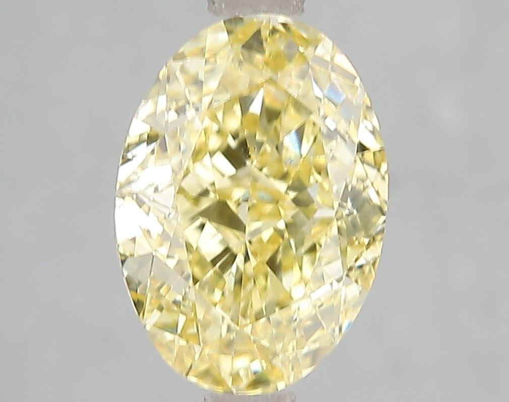 Loose Diamond - OVAL 3.04ct Fancy Vivid Yellow VS2: Loose Diamond - OVAL 3.04ct Fancy Vivid Yellow VS2 Source: This is a real non-mined Diamond that has been grown in a lab Shape: OVAL Carats: 3.04 Color: Fancy Vivid Yellow Certification: IGI Video:
