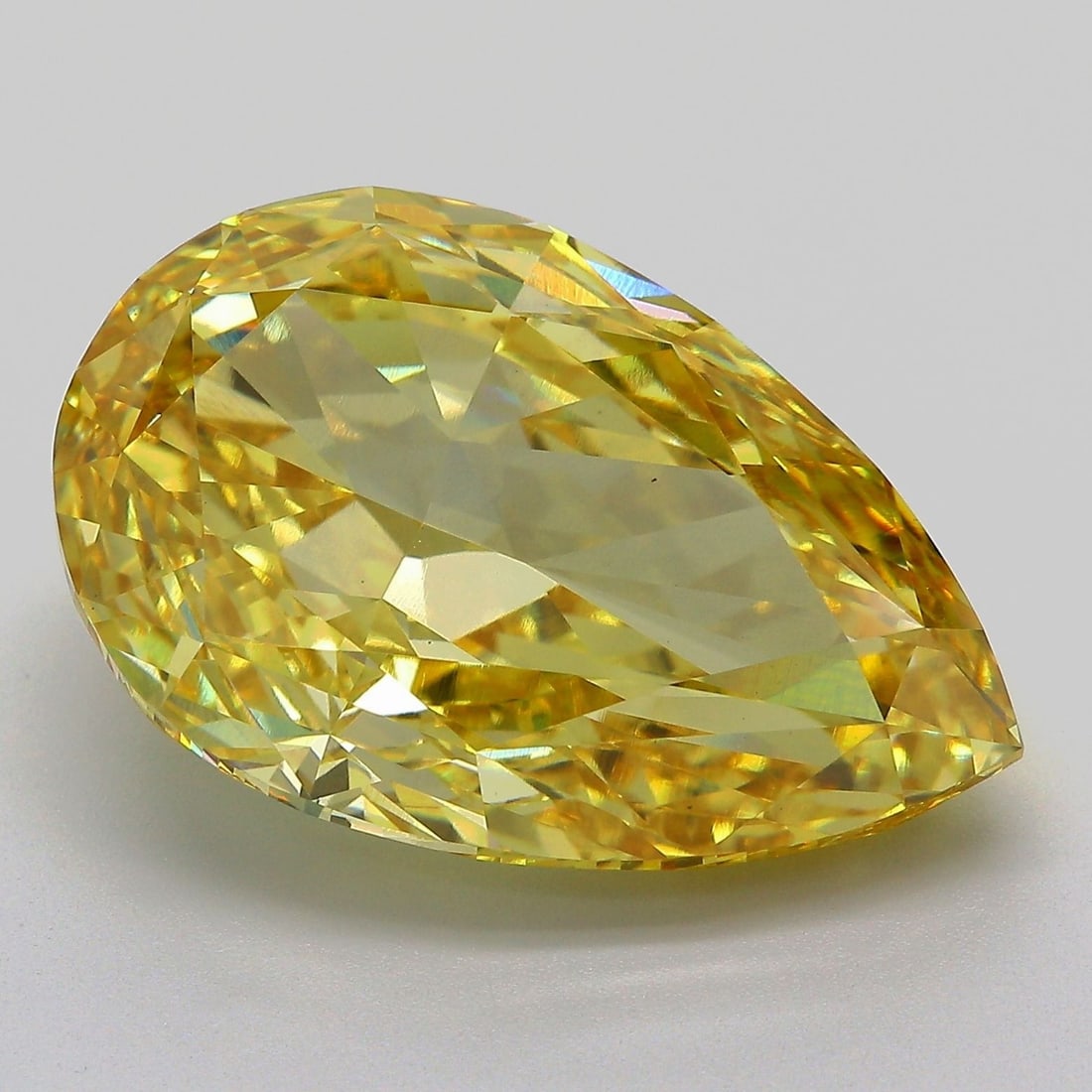 Loose Diamond - PEAR 15.63ct Fancy Vivid Yellow VS1: Loose Diamond - PEAR 15.63ct Fancy Vivid Yellow VS1 Source: This is a real non-mined Diamond that has been grown in a lab Shape: PEAR Carats: 15.63 Color: Fancy Vivid Yellow Certification: IGI Video:
