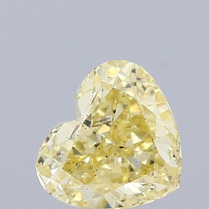 Loose Diamond - HEART 0.85ct Fancy Yellow SI1: Loose Diamond - HEART 0.85ct Fancy Yellow SI1 Source: This is a real non-mined Diamond that has been grown in a lab Shape: HEART Carats: 0.85 Color: Fancy Yellow Certification: IGI Video: