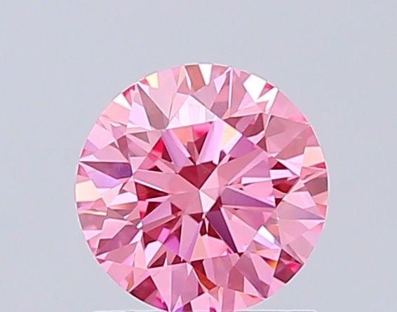 Ideal Loose Diamond - ROUND 1.05ct Fancy Vivid Pink VVS2: Ideal Loose Diamond - ROUND 1.05ct Fancy Vivid Pink VVS2 Source: This is a real non-mined Diamond that has been grown in a lab Shape: ROUND Carats: 1.05 Color: Fancy Vivid Pink Certification: IGI Vide