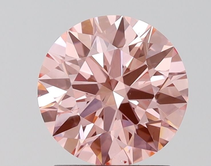 Ideal Loose Diamond - ROUND 1.73ct Fancy Vivid Pink VS2: Ideal Loose Diamond - ROUND 1.73ct Fancy Vivid Pink VS2 Source: This is a real non-mined Diamond that has been grown in a lab Shape: ROUND Carats: 1.73 Color: Fancy Vivid Pink Certification: IGI Video