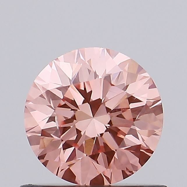 Loose Diamond - ROUND 0.65ct Fancy Vivid Pink VS2: Loose Diamond - ROUND 0.65ct Fancy Vivid Pink VS2 Source: This is a real non-mined Diamond that has been grown in a lab Shape: ROUND Carats: 0.65 Color: Fancy Vivid Pink Certification: IGI Video: