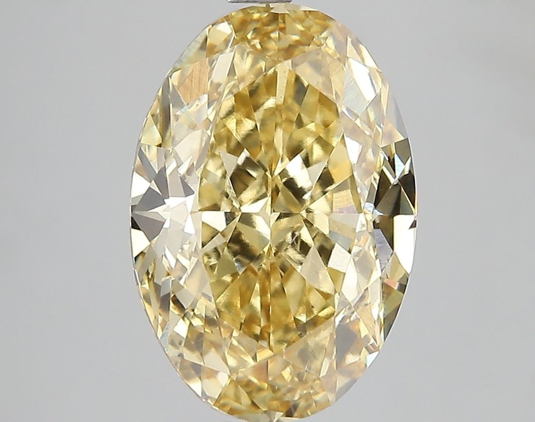 Loose Diamond - OVAL 5.2ct Fancy Vivid Yellow VS2: Loose Diamond - OVAL 5.2ct Fancy Vivid Yellow VS2 Source: This is a real non-mined Diamond that has been grown in a lab Shape: OVAL Carats: 5.2 Color: Fancy Vivid Yellow Certification: IGI Video: