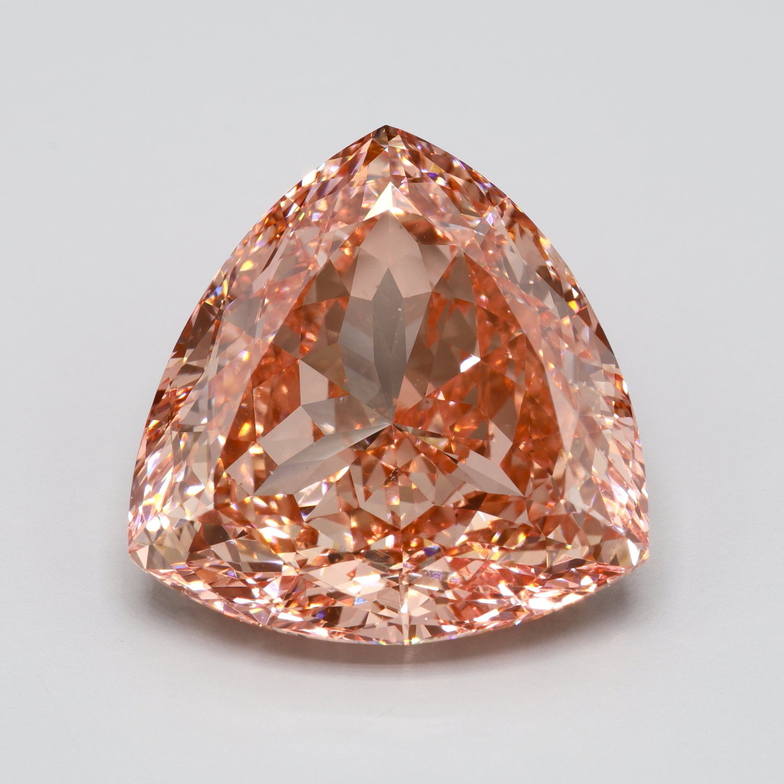 Loose Diamond - TRIANGULAR 14.71ct Fancy Vivid Pink VS2: Loose Diamond - TRIANGULAR 14.71ct Fancy Vivid Pink VS2 Source: This is a real non-mined Diamond that has been grown in a lab Shape: TRIANGULAR Carats: 14.71 Color: Fancy Vivid Pink Certification: IGI