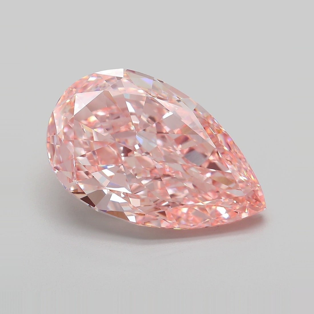 Loose Diamond - PEAR 12.05ct Fancy Vivid Pink VVS2: Loose Diamond - PEAR 12.05ct Fancy Vivid Pink VVS2 Source: This is a real non-mined Diamond that has been grown in a lab Shape: PEAR Carats: 12.05 Color: Fancy Vivid Pink Certification: IGI Video: