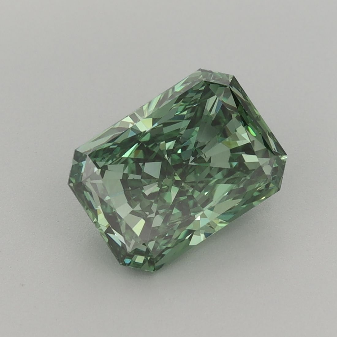 Loose Diamond - RADIANT 2.1ct Fancy Vivid Green VVS2: Loose Diamond - RADIANT 2.1ct Fancy Vivid Green VVS2 Source: This is a real non-mined Diamond that has been grown in a lab Shape: RADIANT Carats: 2.1 Color: Fancy Vivid Green Certification: IGI The Di