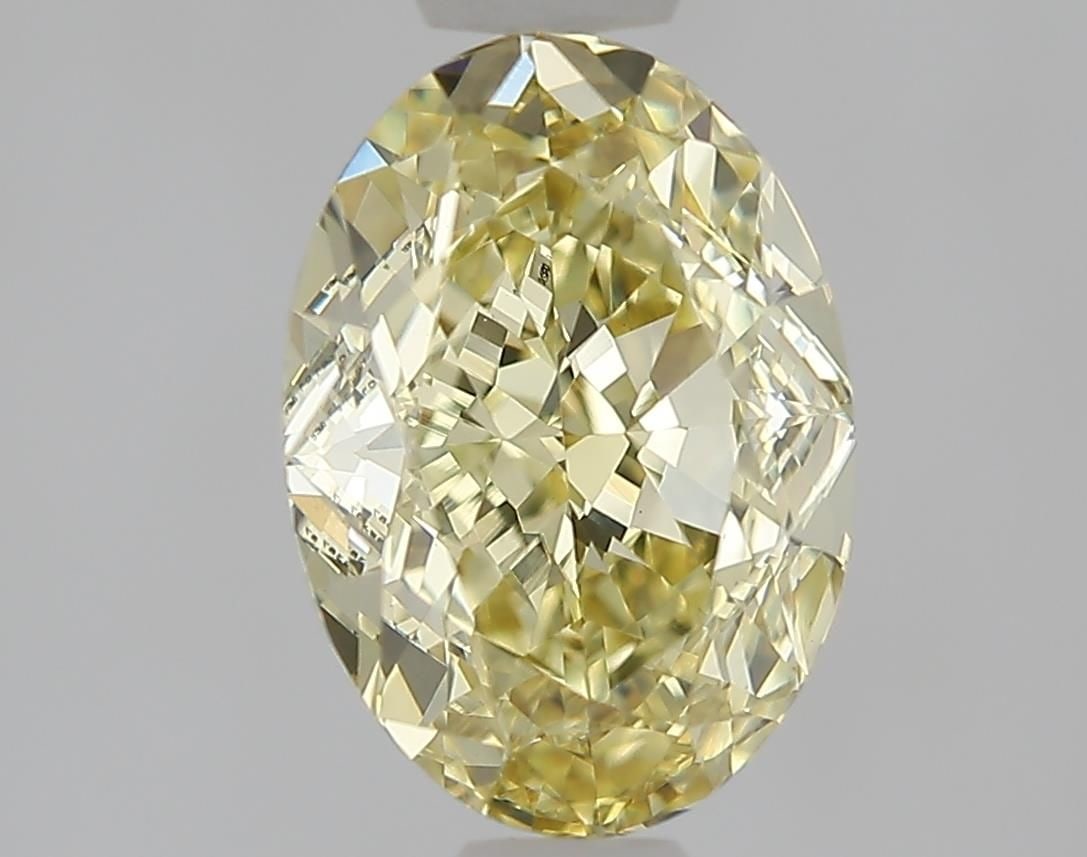 Loose Diamond - OVAL 1.55ct Fancy Light Yellow VS1: Loose Diamond - OVAL 1.55ct Fancy Light Yellow VS1 Source: This is a real non-mined Diamond that has been grown in a lab Shape: OVAL Carats: 1.55 Color: Fancy Light Yellow Certification: IGI Video: