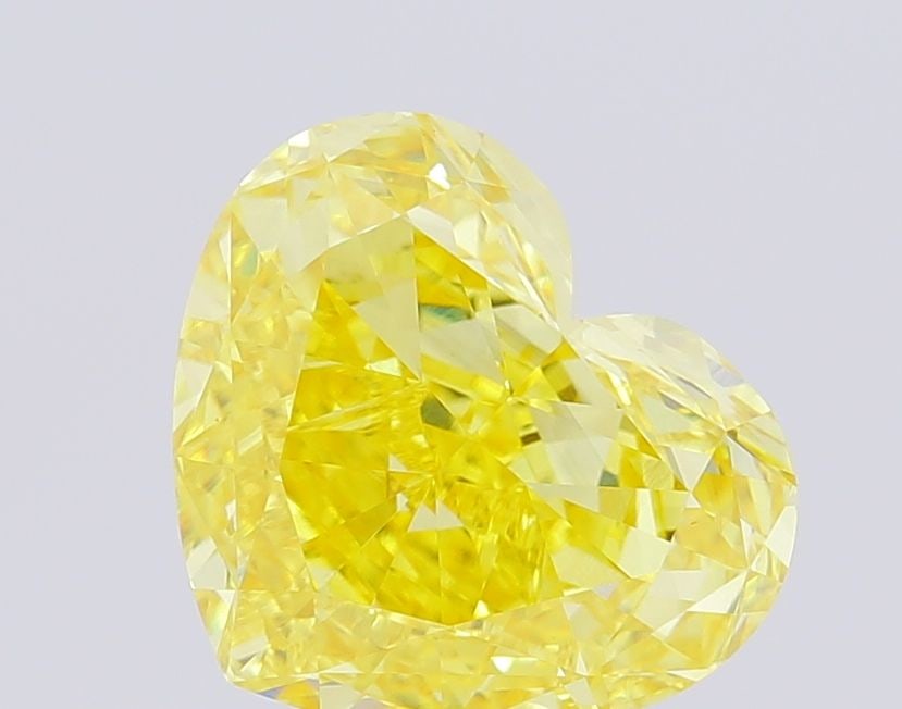 Loose Diamond - HEART 5.96ct Fancy Vivid Yellow VS1: Loose Diamond - HEART 5.96ct Fancy Vivid Yellow VS1 Source: This is a real non-mined Diamond that has been grown in a lab Shape: HEART Carats: 5.96 Color: Fancy Vivid Yellow Certification: IGI Video: