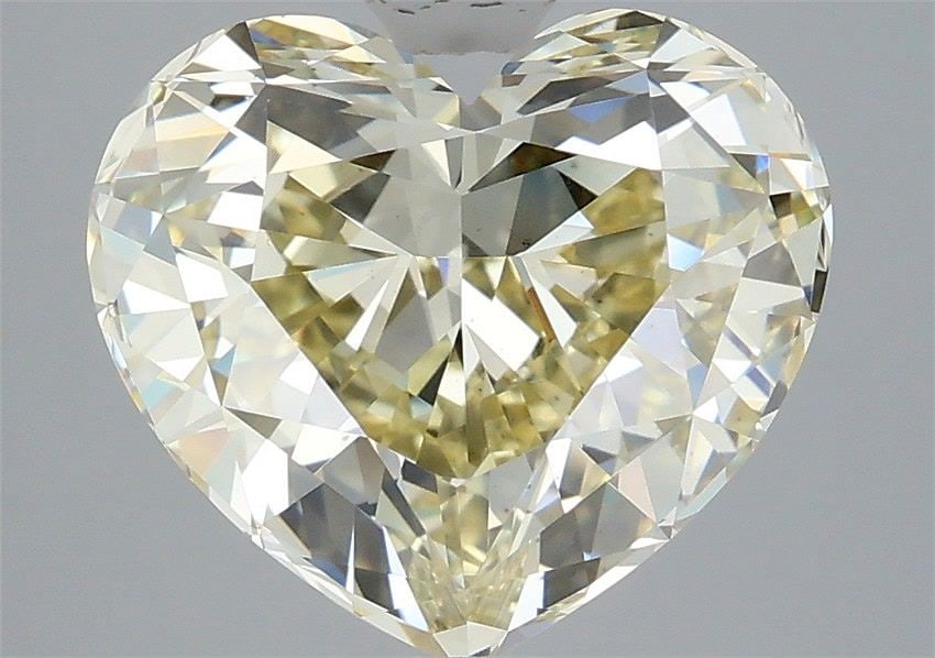 Loose Diamond - HEART 4.41ct Fancy Light Yellow VS1: Loose Diamond - HEART 4.41ct Fancy Light Yellow VS1 Source: This is a real non-mined Diamond that has been grown in a lab Shape: HEART Carats: 4.41 Color: Fancy Light Yellow Certification: IGI Video: