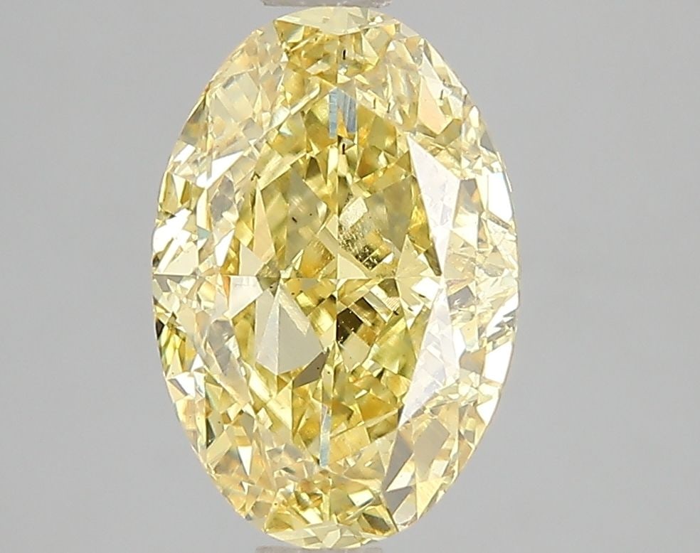 Loose Diamond - OVAL 3.01ct Fancy Vivid Yellow VS2: Loose Diamond - OVAL 3.01ct Fancy Vivid Yellow VS2 Source: This is a real non-mined Diamond that has been grown in a lab Shape: OVAL Carats: 3.01 Color: Fancy Vivid Yellow Certification: IGI Video: