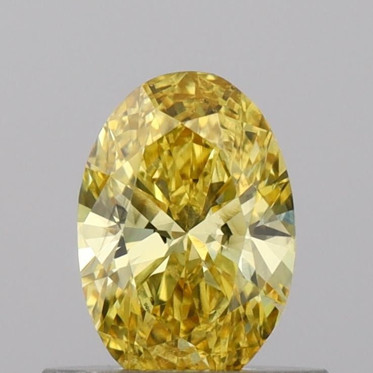 Loose Diamond - OVAL 0.56ct Fancy Vivid Yellow VS1: Loose Diamond - OVAL 0.56ct Fancy Vivid Yellow VS1 Source: This is a real non-mined Diamond that has been grown in a lab Shape: OVAL Carats: 0.56 Color: Fancy Vivid Yellow Certification: IGI Video: