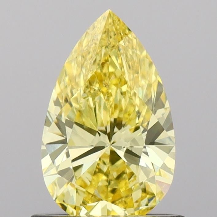 Loose Diamond - PEAR 0.83ct Fancy Vivid Yellow VS2: Loose Diamond - PEAR 0.83ct Fancy Vivid Yellow VS2 Source: This is a real non-mined Diamond that has been grown in a lab Shape: PEAR Carats: 0.83 Color: Fancy Vivid Yellow Certification: IGI Video: