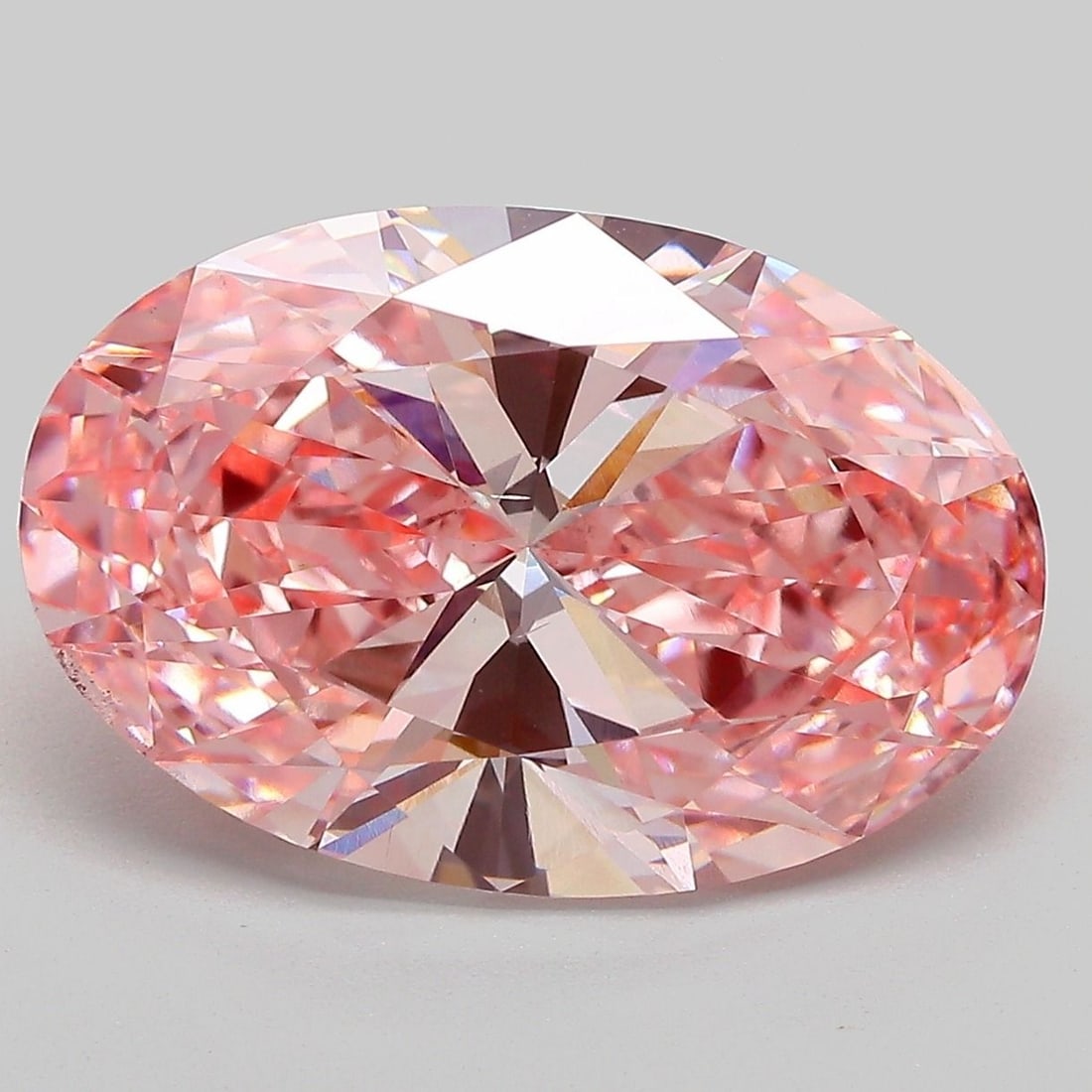 Loose Diamond - OVAL 7.04ct Fancy Vivid Pink VS2: Loose Diamond - OVAL 7.04ct Fancy Vivid Pink VS2 Source: This is a real non-mined Diamond that has been grown in a lab Shape: OVAL Carats: 7.04 Color: Fancy Vivid Pink Certification: IGI Video: