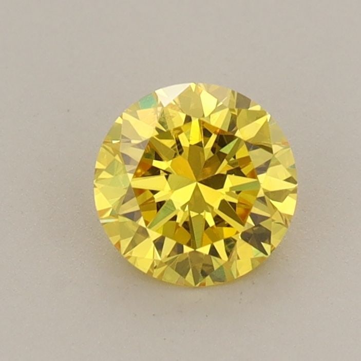 Loose Diamond - ROUND 0.59ct Fancy Vivid Yellow VS2: Loose Diamond - ROUND 0.59ct Fancy Vivid Yellow VS2 Source: This is a real non-mined Diamond that has been grown in a lab Shape: ROUND Carats: 0.59 Color: Fancy Vivid Yellow Certification: IGI Video: