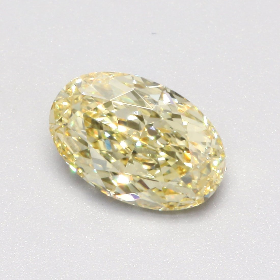 Loose Diamond - OVAL 1.25ct Fancy Yellow VS1: Loose Diamond - OVAL 1.25ct Fancy Yellow VS1 Source: This is a real non-mined Diamond that has been grown in a lab Shape: OVAL Carats: 1.25 Color: Fancy Yellow Certification: IGI Video:
