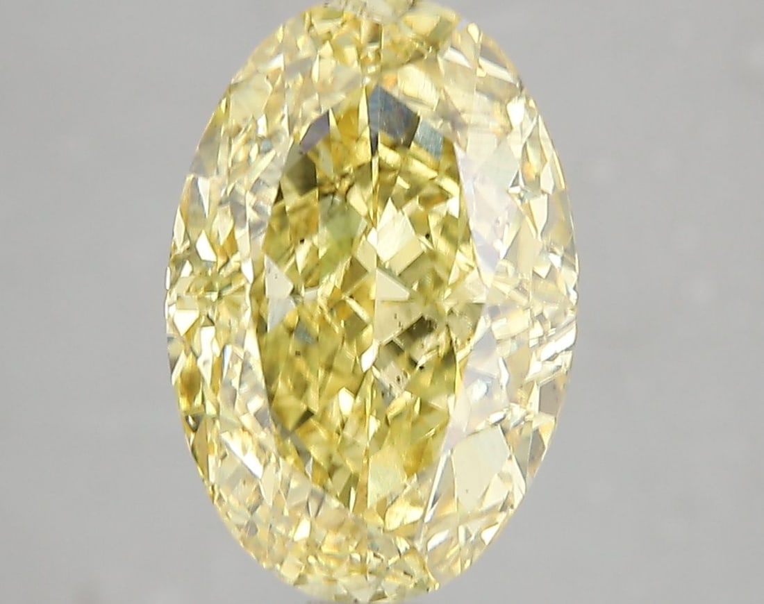 Loose Diamond - OVAL 5.12ct Fancy Vivid Yellow SI1: Loose Diamond - OVAL 5.12ct Fancy Vivid Yellow SI1 Source: This is a real non-mined Diamond that has been grown in a lab Shape: OVAL Carats: 5.12 Color: Fancy Vivid Yellow Certification: IGI Video: