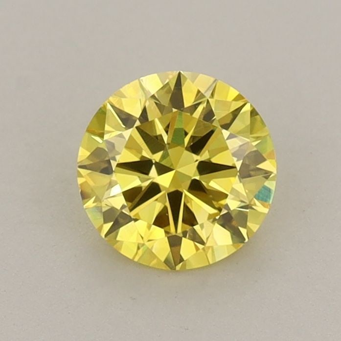 Loose Diamond - ROUND 0.67ct Fancy Vivid Yellow VS1: Loose Diamond - ROUND 0.67ct Fancy Vivid Yellow VS1 Source: This is a real non-mined Diamond that has been grown in a lab Shape: ROUND Carats: 0.67 Color: Fancy Vivid Yellow Certification: IGI Video: