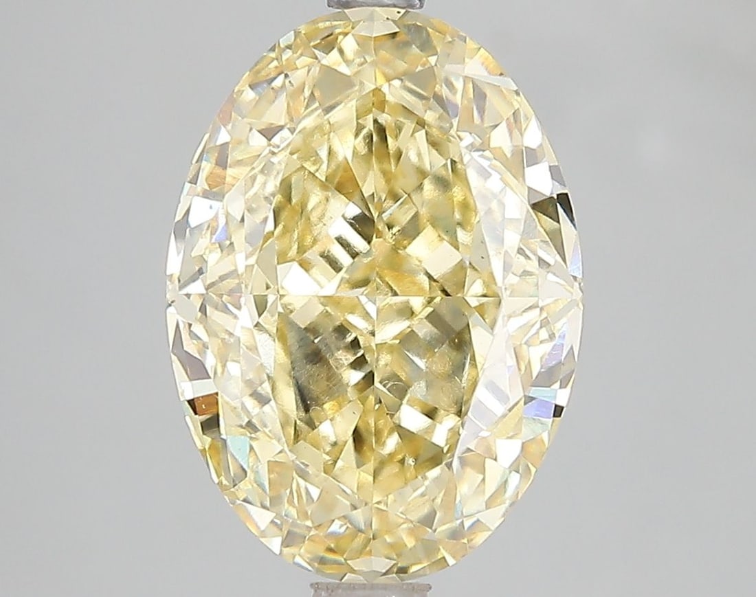 Loose Diamond - OVAL 5.04ct Fancy Vivid Yellow VS2: Loose Diamond - OVAL 5.04ct Fancy Vivid Yellow VS2 Source: This is a real non-mined Diamond that has been grown in a lab Shape: OVAL Carats: 5.04 Color: Fancy Vivid Yellow Certification: IGI Video: