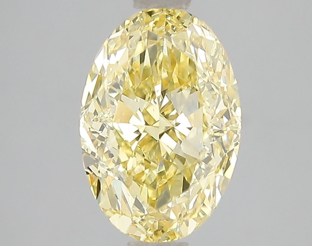 Loose Diamond - OVAL 3.01ct Fancy Vivid Yellow VS2: Loose Diamond - OVAL 3.01ct Fancy Vivid Yellow VS2 Source: This is a real non-mined Diamond that has been grown in a lab Shape: OVAL Carats: 3.01 Color: Fancy Vivid Yellow Certification: IGI Video: