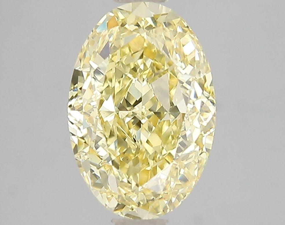 Loose Diamond - OVAL 3.03ct Fancy Vivid Yellow VS1: Loose Diamond - OVAL 3.03ct Fancy Vivid Yellow VS1 Source: This is a real non-mined Diamond that has been grown in a lab Shape: OVAL Carats: 3.03 Color: Fancy Vivid Yellow Certification: IGI Video: