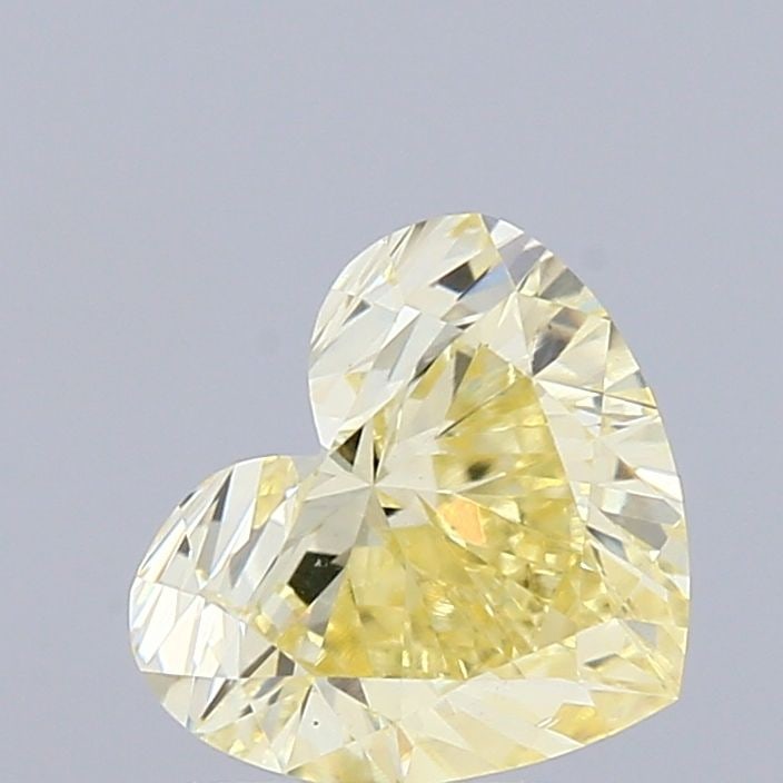 Loose Diamond - HEART 0.9ct Fancy Yellow VS1: Loose Diamond - HEART 0.9ct Fancy Yellow VS1 Source: This is a real non-mined Diamond that has been grown in a lab Shape: HEART Carats: 0.9 Color: Fancy Yellow Certification: IGI Video: