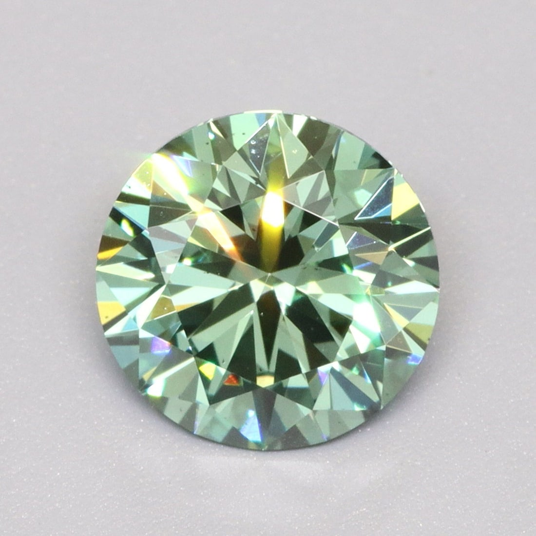 Ideal Loose Diamond - ROUND 1.07ct Fancy Vivid Green VS2: Ideal Loose Diamond - ROUND 1.07ct Fancy Vivid Green VS2 Source: This is a real non-mined Diamond that has been grown in a lab Shape: ROUND Carats: 1.07 Color: Fancy Vivid Green Certification: IGI Vid