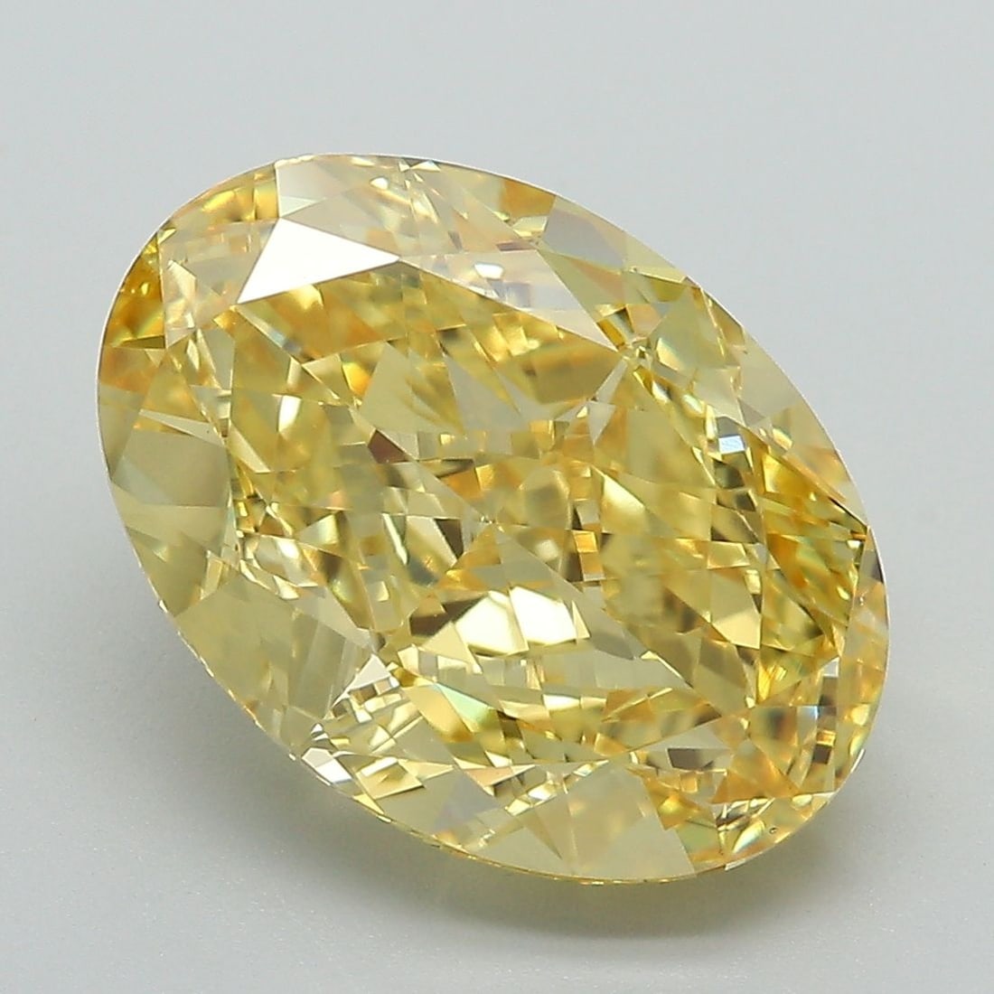 Loose Diamond - OVAL 7.02ct Fancy Vivid Yellow VS1: Loose Diamond - OVAL 7.02ct Fancy Vivid Yellow VS1 Source: This is a real non-mined Diamond that has been grown in a lab Shape: OVAL Carats: 7.02 Color: Fancy Vivid Yellow Certification: IGI Video: