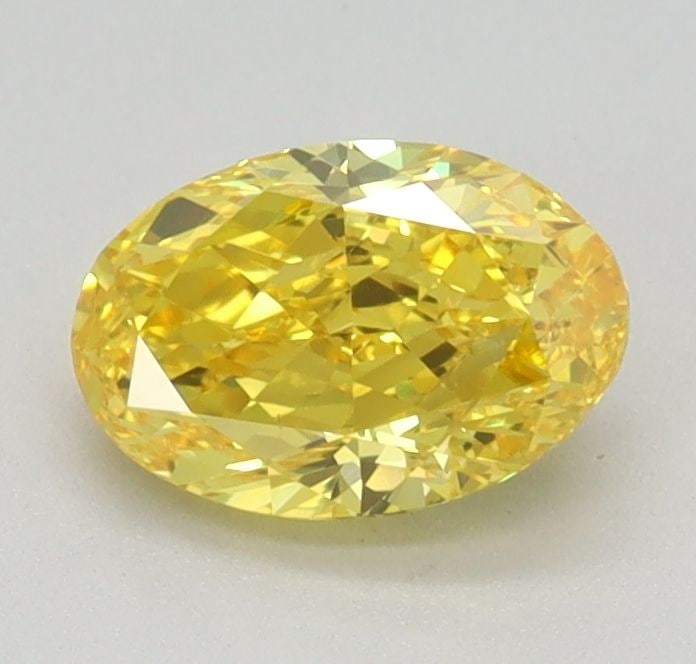 Loose Diamond - OVAL 0.73ct Fancy Vivid Yellow VVS2: Loose Diamond - OVAL 0.73ct Fancy Vivid Yellow VVS2 Source: This is a real non-mined Diamond that has been grown in a lab Shape: OVAL Carats: 0.73 Color: Fancy Vivid Yellow Certification: IGI Video: