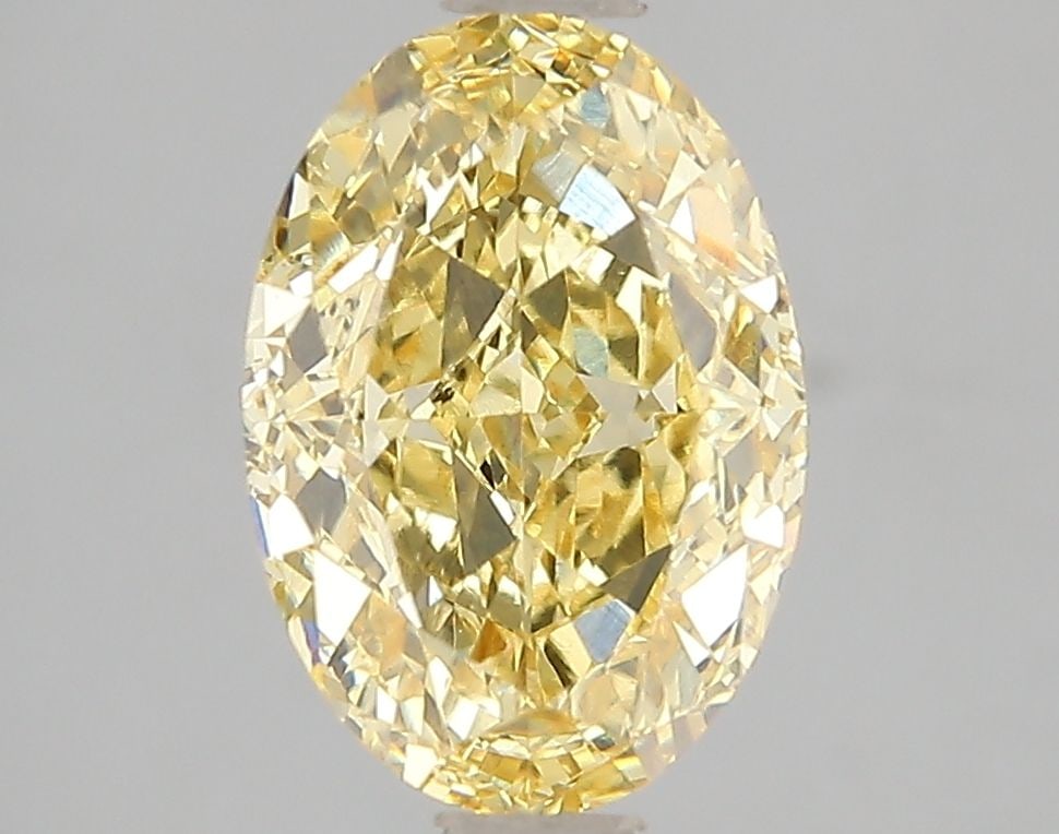 Loose Diamond - OVAL 3.0ct Fancy Vivid Yellow VS1: Loose Diamond - OVAL 3.0ct Fancy Vivid Yellow VS1 Source: This is a real non-mined Diamond that has been grown in a lab Shape: OVAL Carats: 3.0 Color: Fancy Vivid Yellow Certification: IGI Video: