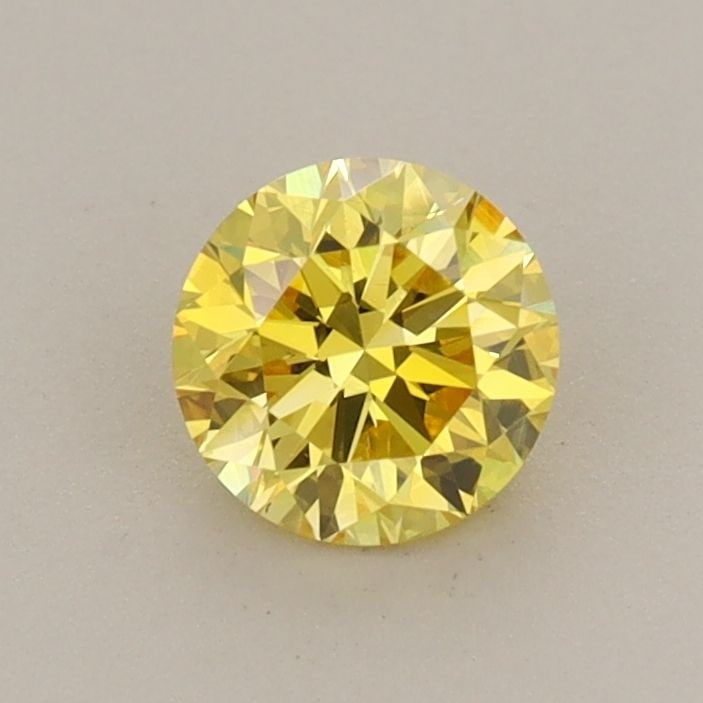 Loose Diamond - ROUND 0.59ct Fancy Vivid Yellow VS1: Loose Diamond - ROUND 0.59ct Fancy Vivid Yellow VS1 Source: This is a real non-mined Diamond that has been grown in a lab Shape: ROUND Carats: 0.59 Color: Fancy Vivid Yellow Certification: IGI Video: