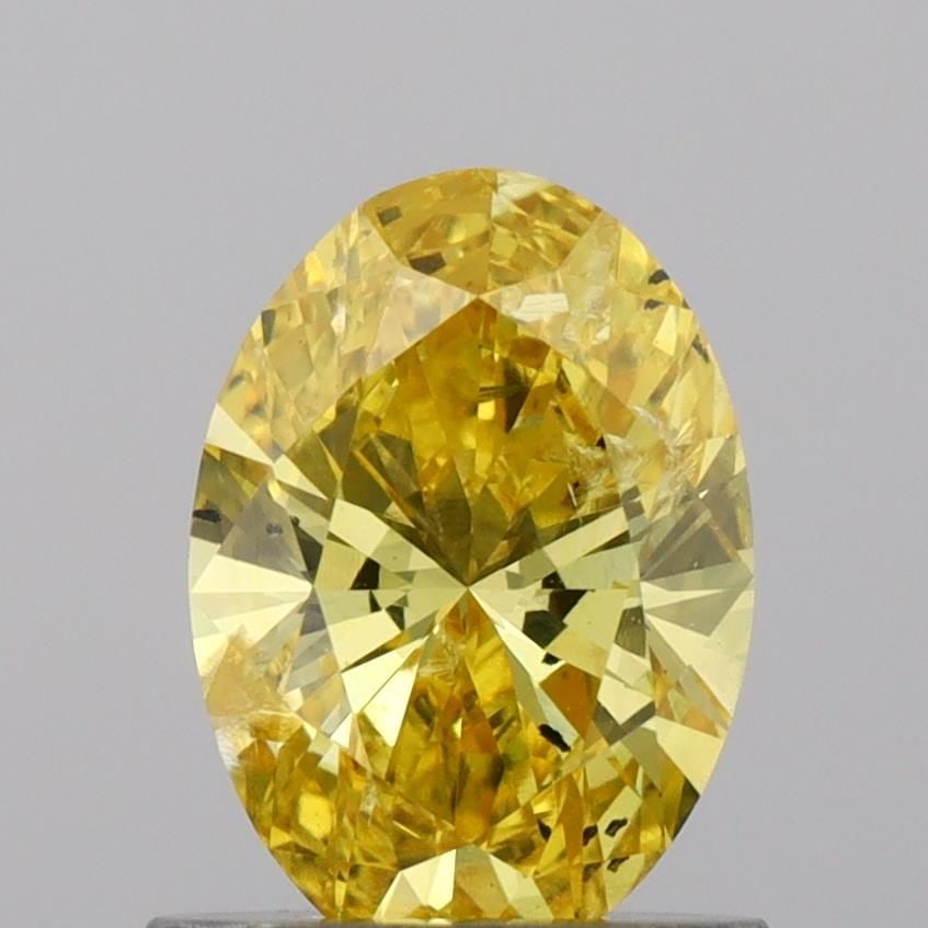 Loose Diamond - OVAL 0.85ct Fancy Vivid Yellow SI1: Loose Diamond - OVAL 0.85ct Fancy Vivid Yellow SI1 Source: This is a real non-mined Diamond that has been grown in a lab Shape: OVAL Carats: 0.85 Color: Fancy Vivid Yellow Certification: IGI Video: