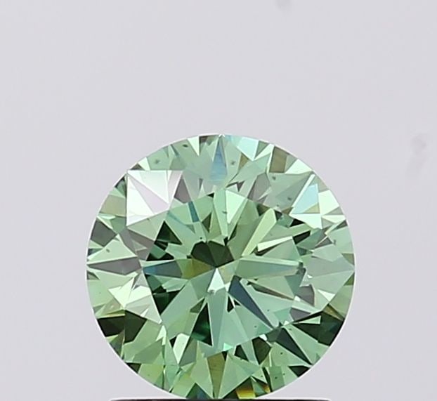 Loose Diamond - ROUND 1.1ct Fancy Vivid Green VS2: Loose Diamond - ROUND 1.1ct Fancy Vivid Green VS2 Source: This is a real non-mined Diamond that has been grown in a lab Shape: ROUND Carats: 1.1 Color: Fancy Vivid Green Certification: IGI Video: