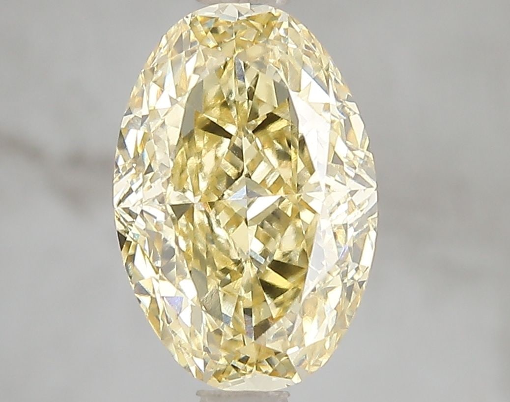 Loose Diamond - OVAL 3.06ct Fancy Vivid Yellow VS1: Loose Diamond - OVAL 3.06ct Fancy Vivid Yellow VS1 Source: This is a real non-mined Diamond that has been grown in a lab Shape: OVAL Carats: 3.06 Color: Fancy Vivid Yellow Certification: IGI Video: