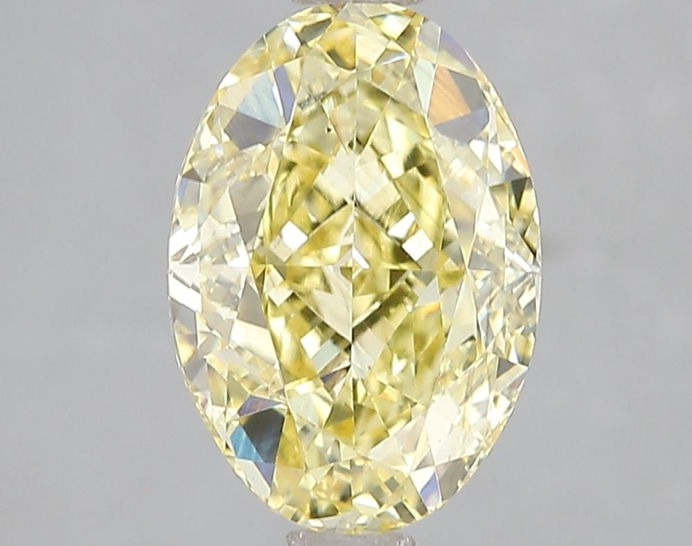 Loose Diamond - OVAL 3.03ct Fancy Vivid Yellow VS2: Loose Diamond - OVAL 3.03ct Fancy Vivid Yellow VS2 Source: This is a real non-mined Diamond that has been grown in a lab Shape: OVAL Carats: 3.03 Color: Fancy Vivid Yellow Certification: IGI Video: