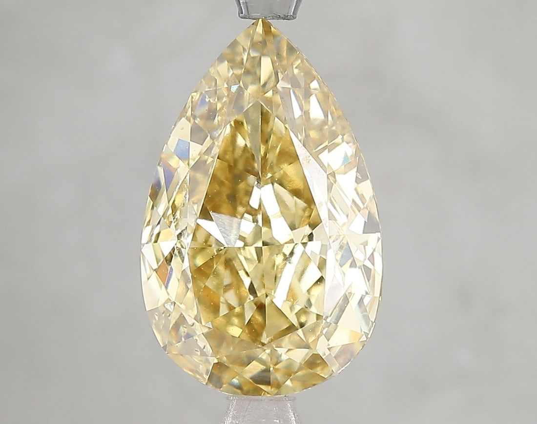 Loose Diamond - PEAR 5.01ct Fancy Vivid Yellow VS1: Loose Diamond - PEAR 5.01ct Fancy Vivid Yellow VS1 Source: This is a real non-mined Diamond that has been grown in a lab Shape: PEAR Carats: 5.01 Color: Fancy Vivid Yellow Certification: IGI Video:
