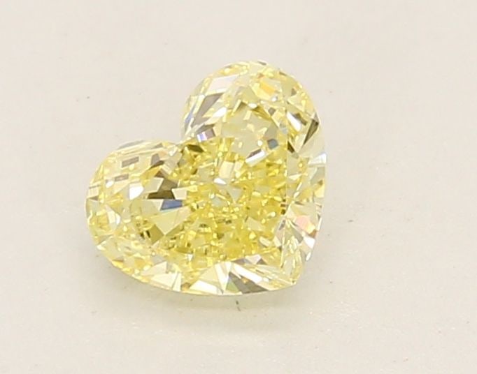 Loose Diamond - HEART 0.62ct Fancy Yellow VVS2: Loose Diamond - HEART 0.62ct Fancy Yellow VVS2 Source: This is a real non-mined Diamond that has been grown in a lab Shape: HEART Carats: 0.62 Color: Fancy Yellow Certification: IGI Video: