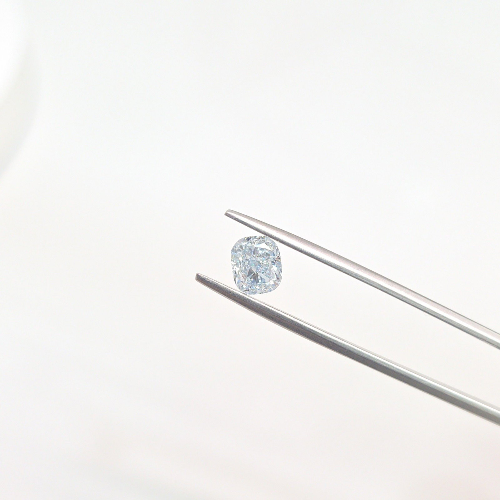 Loose Diamond - CUSHION MODIFIED 1.19ct Light Blue VVS2: Loose Diamond - CUSHION MODIFIED 1.19ct Light Blue VVS2 Source: This is a real non-mined Diamond that has been grown in a lab Shape: CUSHION MODIFIED Carats: 1.19 Color: Light Blue Certification: IGI 