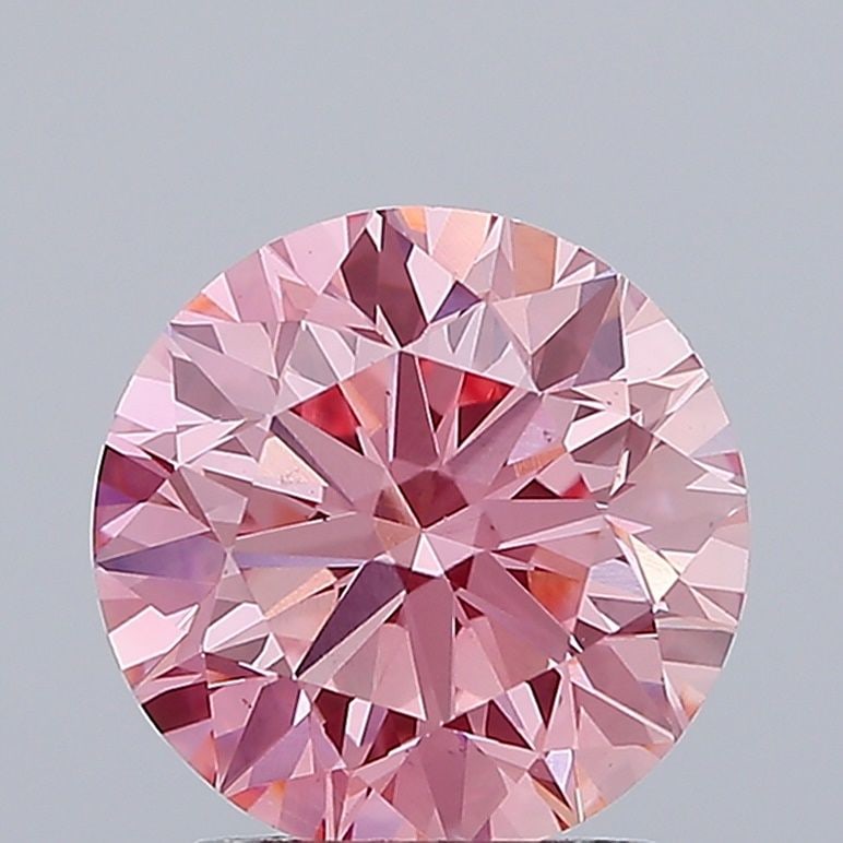 Loose Diamond - ROUND 2.34ct Fancy Vivid Pink VS1: Loose Diamond - ROUND 2.34ct Fancy Vivid Pink VS1 Source: This is a real non-mined Diamond that has been grown in a lab Shape: ROUND Carats: 2.34 Color: Fancy Vivid Pink Certification: IGI Video: