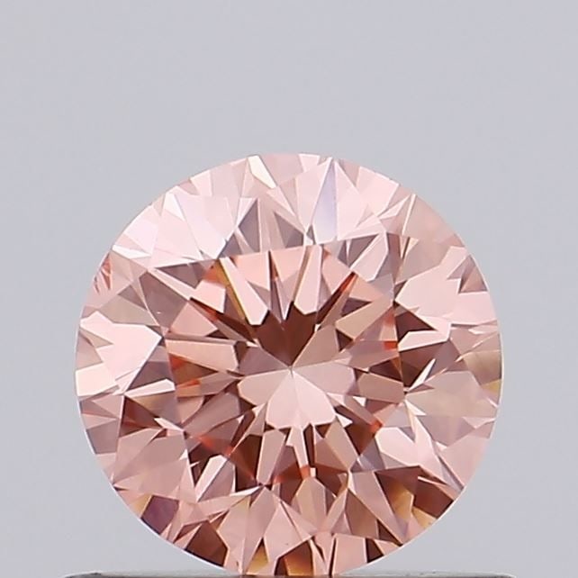 Loose Diamond - ROUND 0.63ct Fancy Vivid Pink VS2: Loose Diamond - ROUND 0.63ct Fancy Vivid Pink VS2 Source: This is a real non-mined Diamond that has been grown in a lab Shape: ROUND Carats: 0.63 Color: Fancy Vivid Pink Certification: IGI Video: