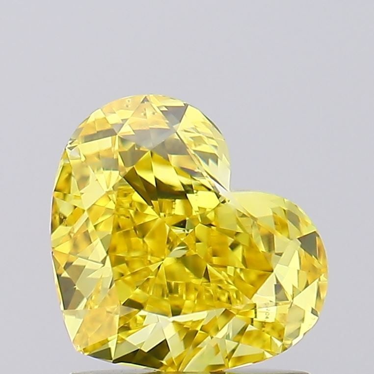 Loose Diamond - HEART 1.14ct Fancy Vivid Yellow VS2: Loose Diamond - HEART 1.14ct Fancy Vivid Yellow VS2 Source: This is a real non-mined Diamond that has been grown in a lab Shape: HEART Carats: 1.14 Color: Fancy Vivid Yellow Certification: IGI Video: