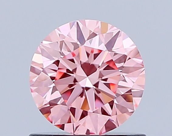 Loose Diamond - ROUND 0.77ct Fancy Vivid Pink VVS1: Loose Diamond - ROUND 0.77ct Fancy Vivid Pink VVS1 Source: This is a real non-mined Diamond that has been grown in a lab Shape: ROUND Carats: 0.77 Color: Fancy Vivid Pink Certification: IGI Video: