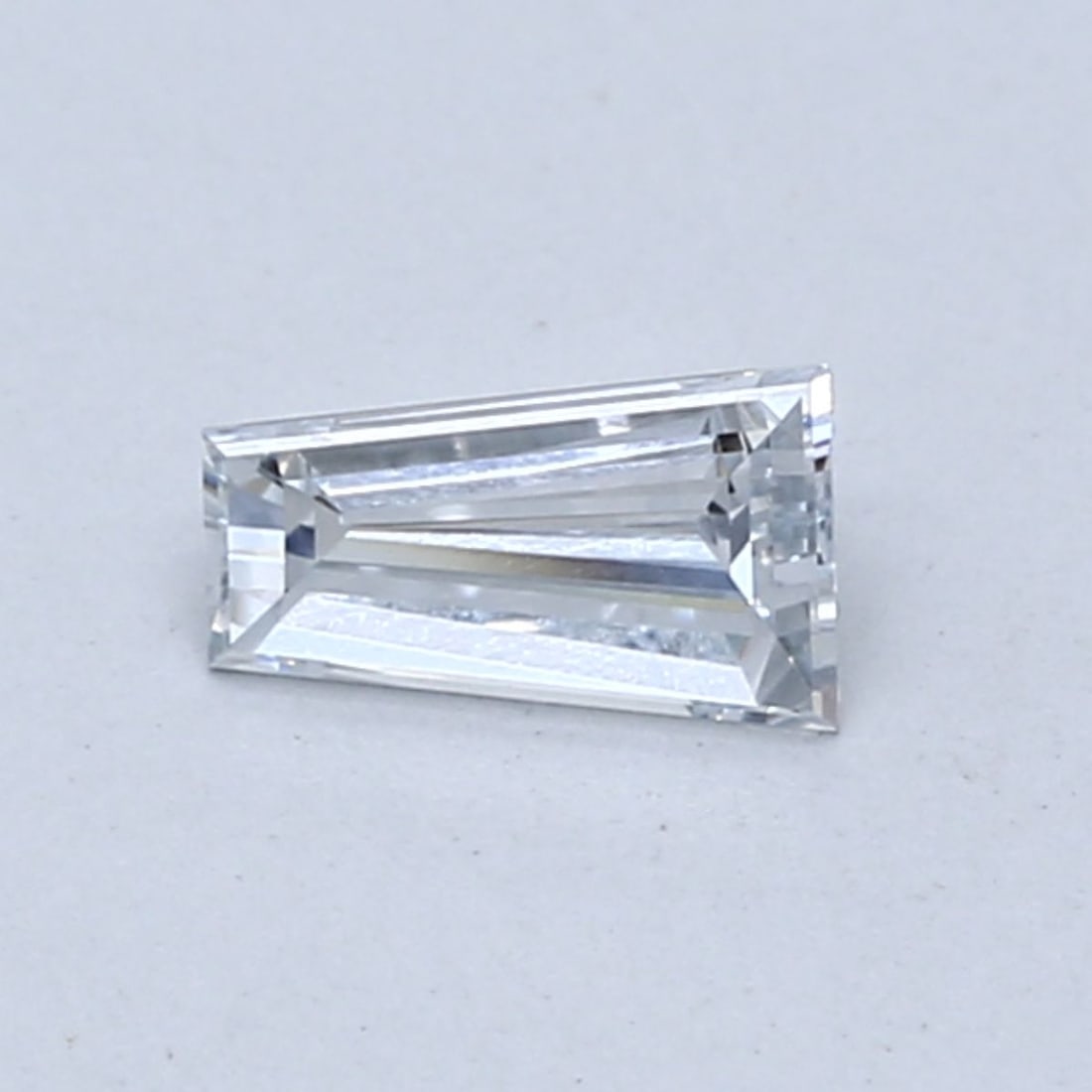 Loose Diamond - TAPERED BAGUETTE 0.38ct Fancy Light Blue VS1: Loose Diamond - TAPERED BAGUETTE 0.38ct Fancy Light Blue VS1 Source: This is a real non-mined Diamond that has been grown in a lab Shape: TAPERED BAGUETTE Carats: 0.38 Color: Fancy Light Blue Certific