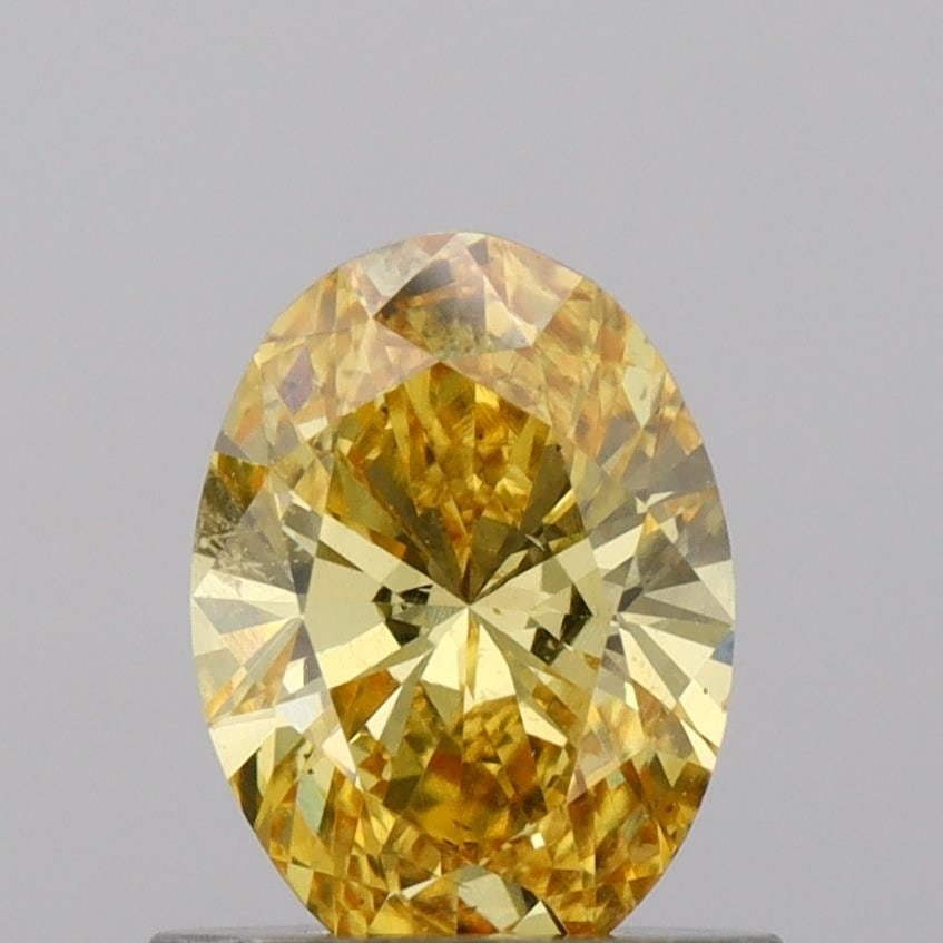 Loose Diamond - OVAL 0.74ct Fancy Vivid Yellow VS2: Loose Diamond - OVAL 0.74ct Fancy Vivid Yellow VS2 Source: This is a real non-mined Diamond that has been grown in a lab Shape: OVAL Carats: 0.74 Color: Fancy Vivid Yellow Certification: IGI Video: