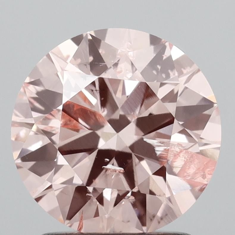 Loose Diamond - ROUND 1.7ct Fancy Vivid Pink I1: Loose Diamond - ROUND 1.7ct Fancy Vivid Pink I1 Source: This is a real non-mined Diamond that has been grown in a lab Shape: ROUND Carats: 1.7 Color: Fancy Vivid Pink Certification: IGI Video: