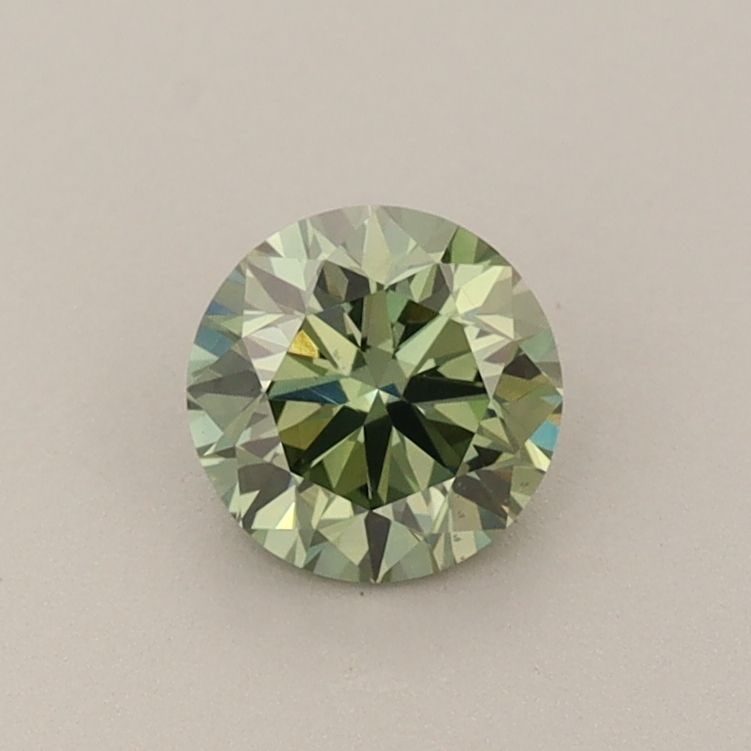 Loose Diamond - ROUND 0.6ct Fancy Vivid Green VVS2: Loose Diamond - ROUND 0.6ct Fancy Vivid Green VVS2 Source: This is a real non-mined Diamond that has been grown in a lab Shape: ROUND Carats: 0.6 Color: Fancy Vivid Green Certification: IGI Video: