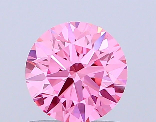Ideal Loose Diamond - ROUND 1.07ct Fancy Vivid Pink VS1: Ideal Loose Diamond - ROUND 1.07ct Fancy Vivid Pink VS1 Source: This is a real non-mined Diamond that has been grown in a lab Shape: ROUND Carats: 1.07 Color: Fancy Vivid Pink Certification: IGI Video